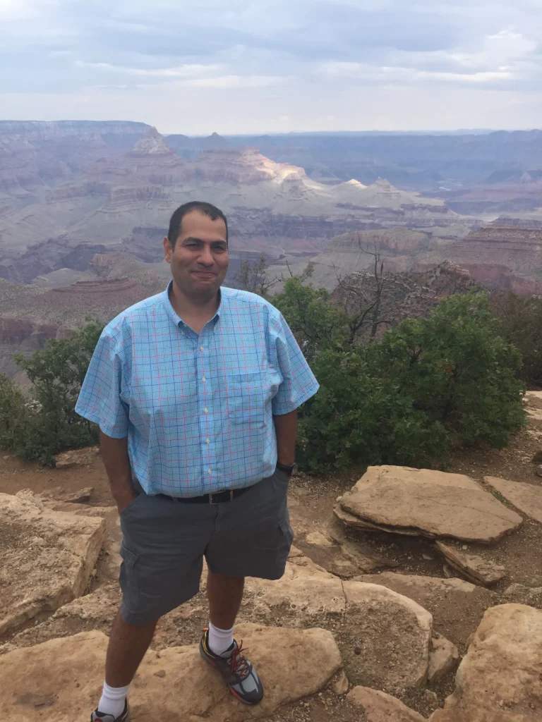 Ozzy Osman, founder of the Arizona Coffee Shop Directory during a hike in Arizona mountains