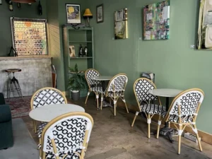 Cactus Cloud Cafe inside tables and chairs. the Barista bar is showing in the background