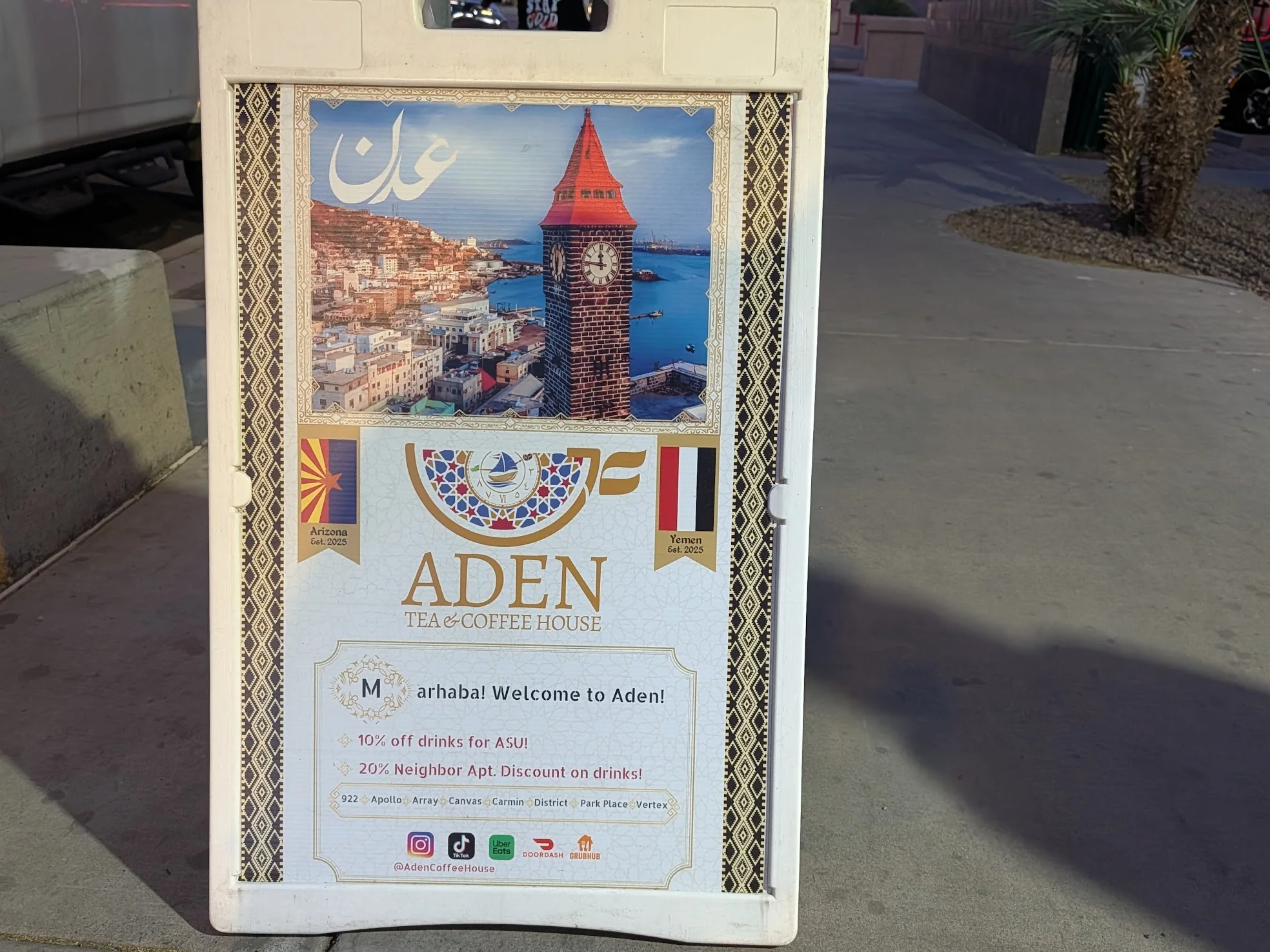Aden Sign on the side walk