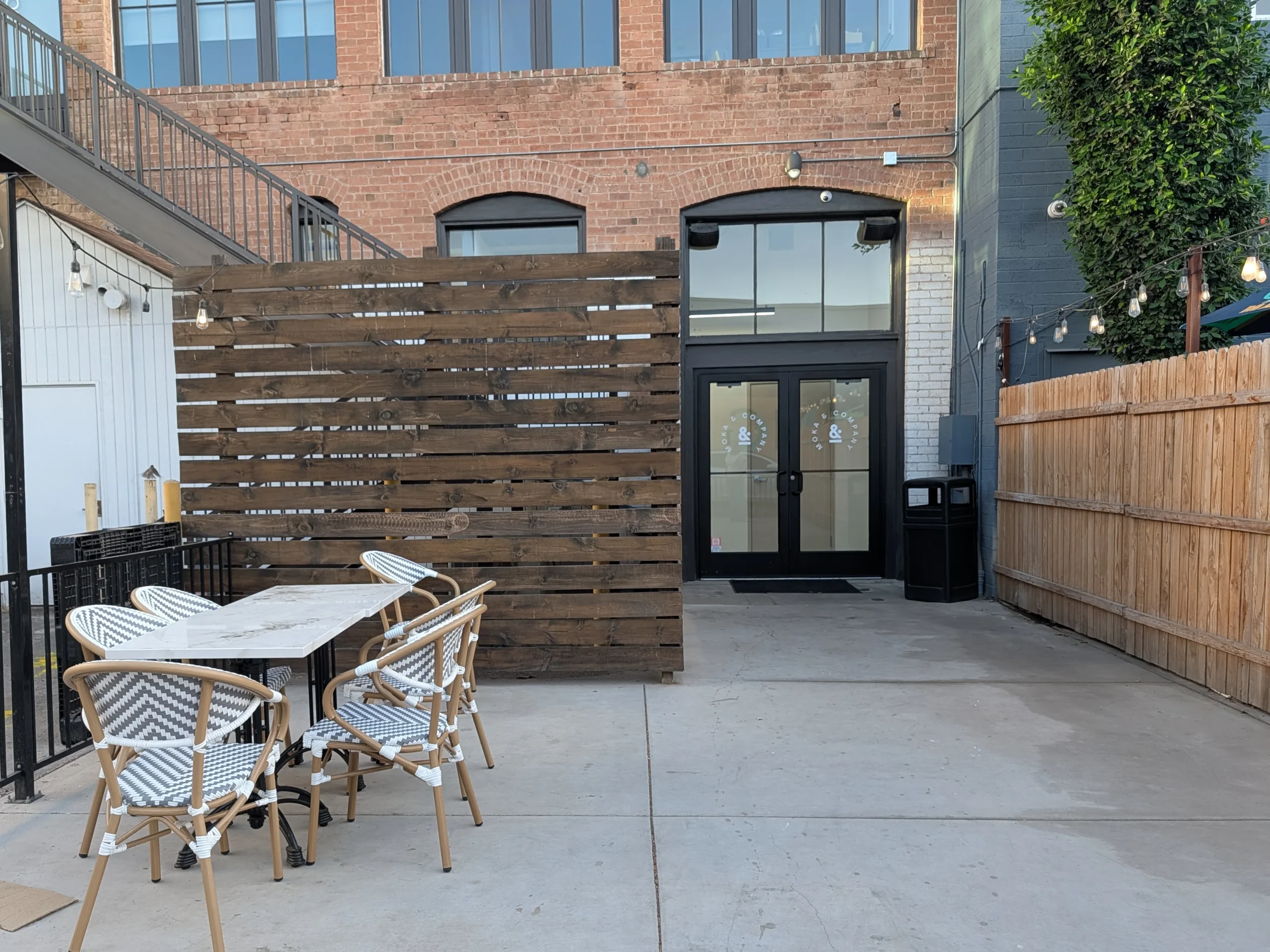 Moka and Co Back Patio showing table and chairs for seating