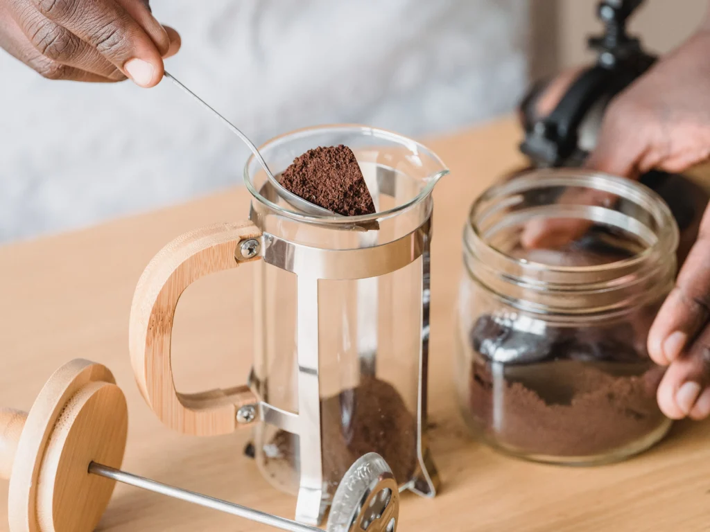 Coffee grounds are placed inside a French Press and are ready for brewing